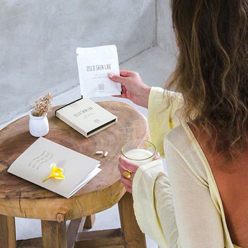 The Glow on table woman holding package